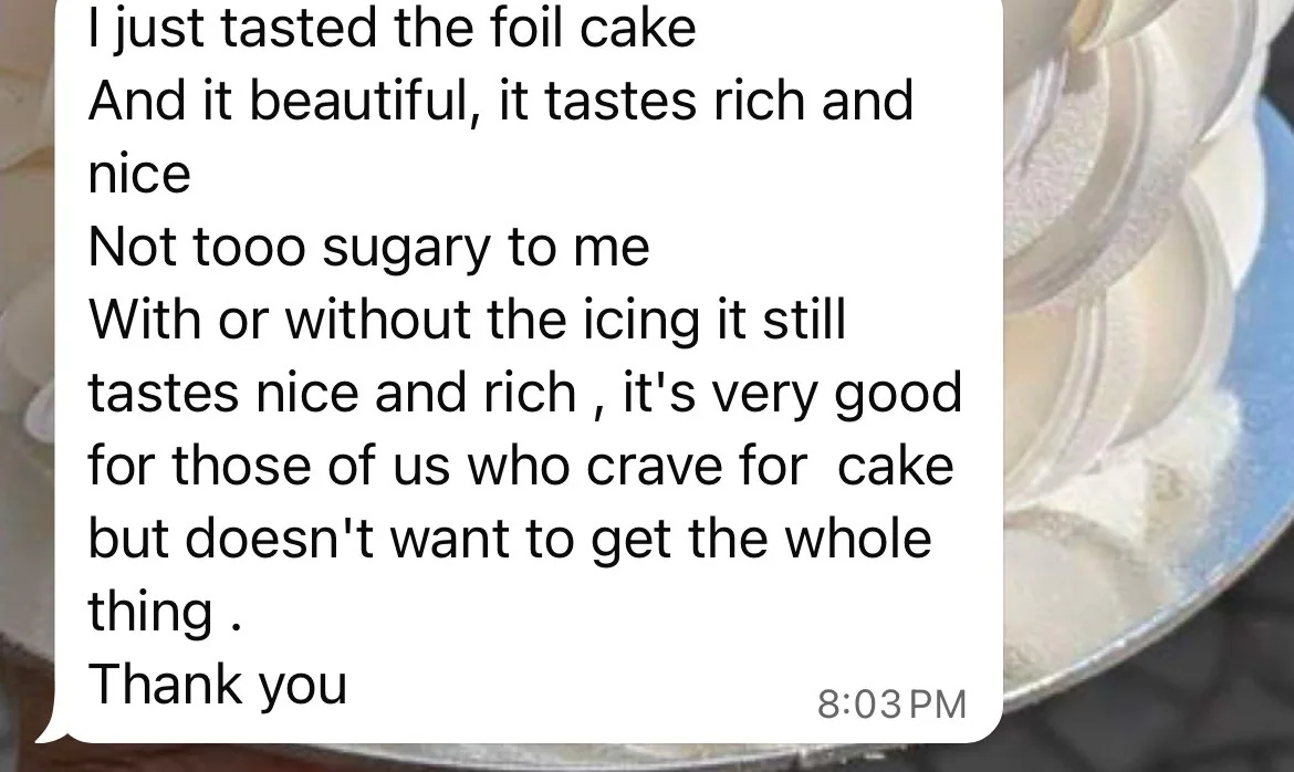 Customer review describing a foil cake as rich, delicious, and not too sugary
